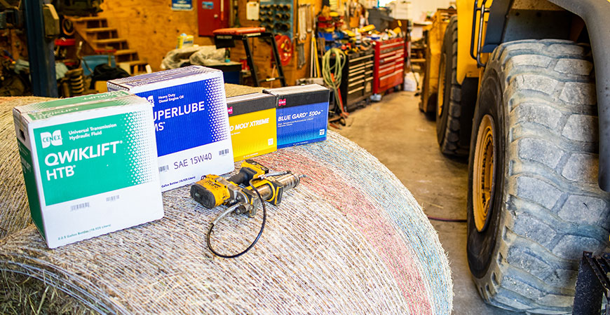 Qwiklift HTB, Superlube TMS, HD Moly Xtreme and Blue Gard 500+ on a bale of hay