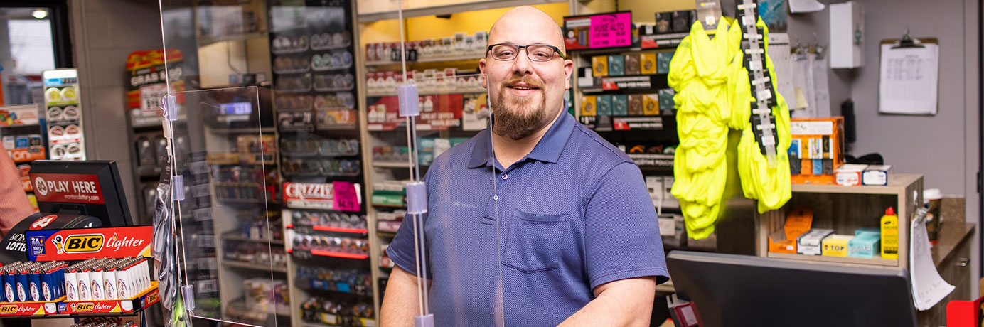 Employee at a Cenex Zip Trip convenience store register