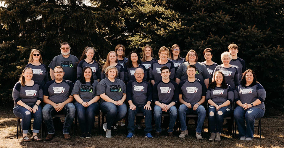 Group of people wearing Cares for Cancer shirts