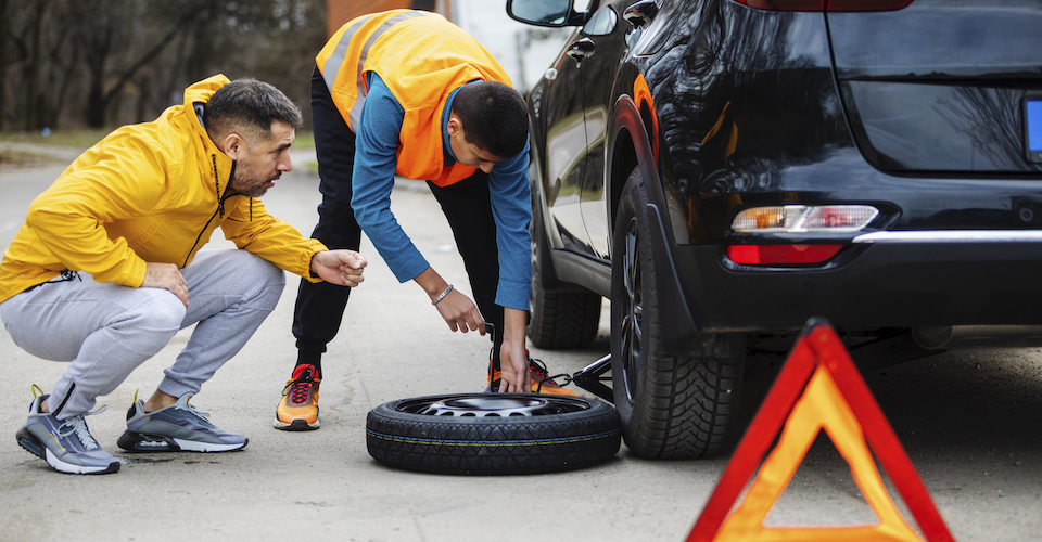 Changing a tire on a car