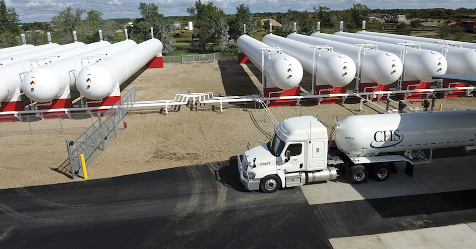 CHS propane truck in front of propane tanks