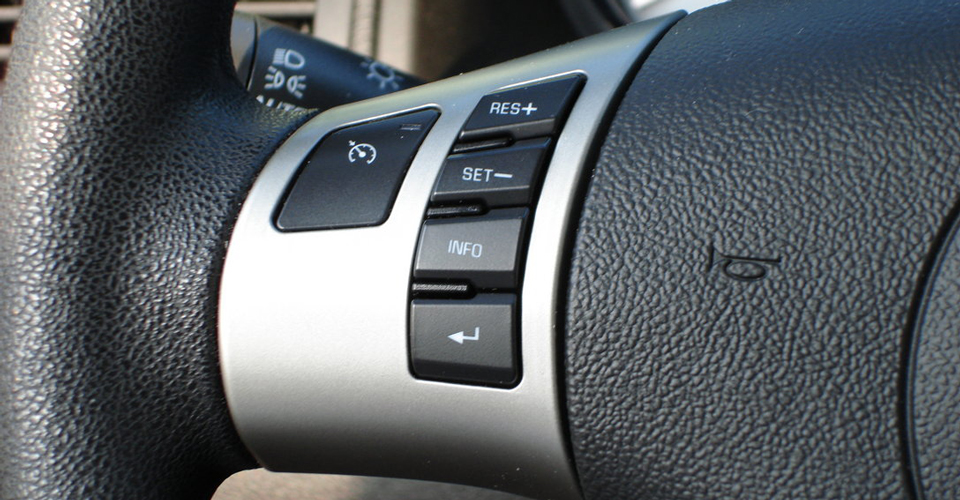 Cruise control buttons on a steering wheel
