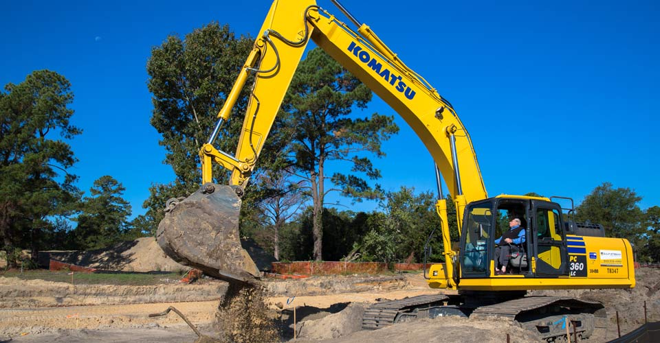 Excavator digging up dirt