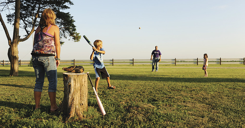 Farm family playing baseball