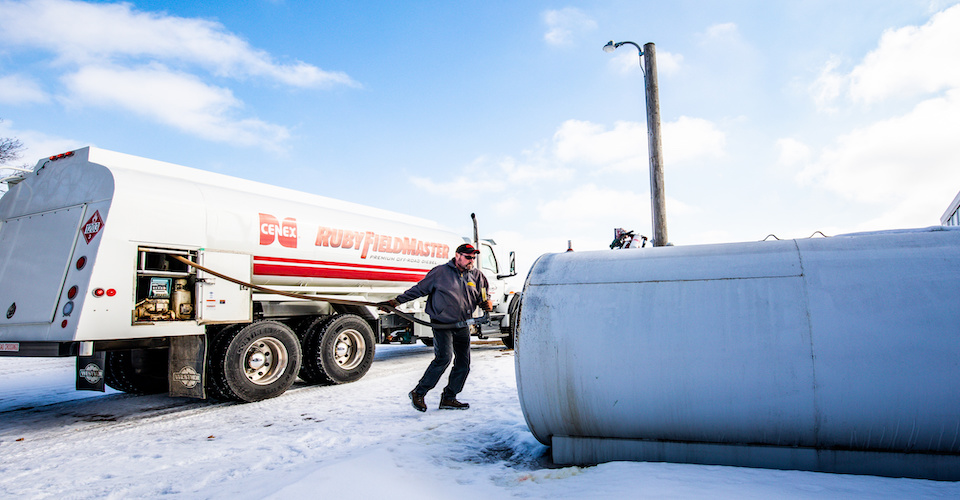 Man getting ready to fill propane tank with Cenex Ruby FieldMaster