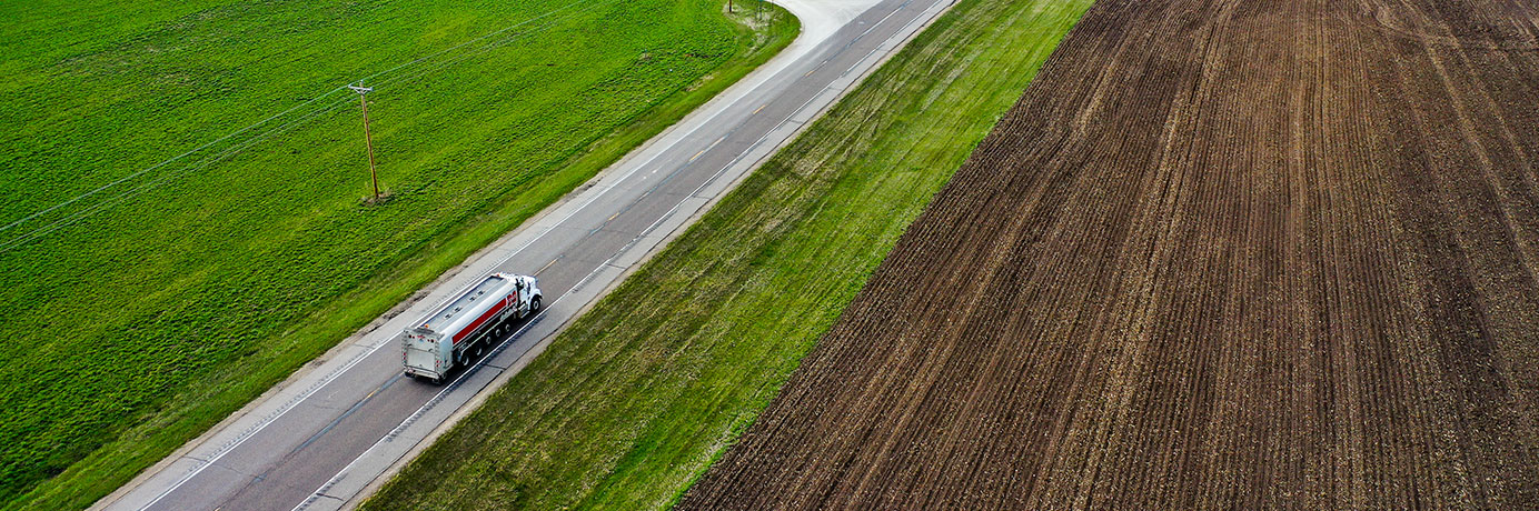 Truck driving down a country road