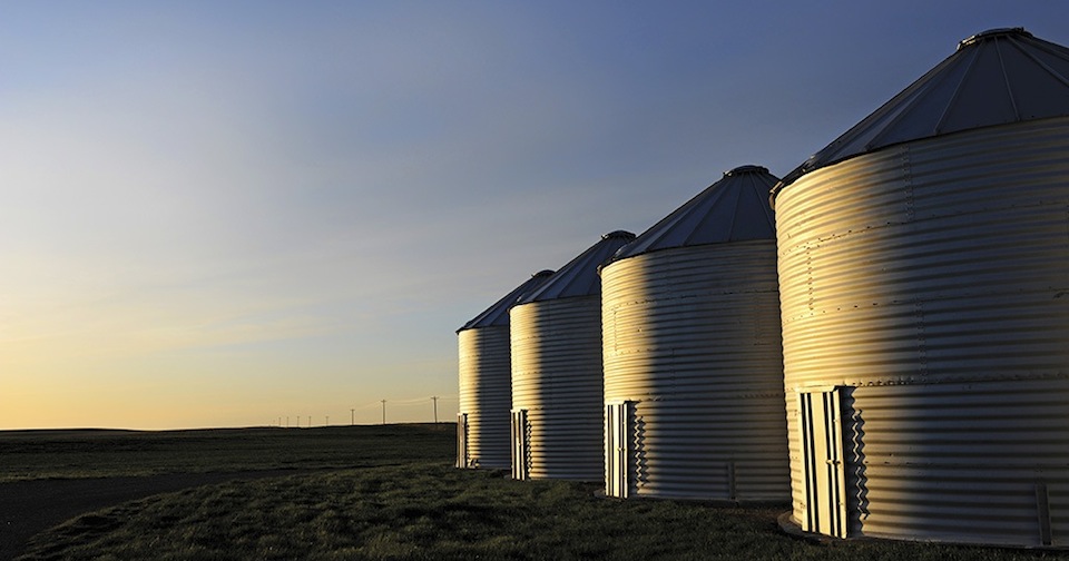 Grain bins in the sunset