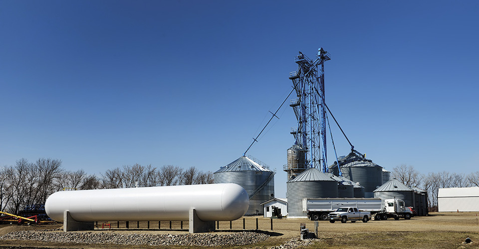 Large propane storage tank in front of an elevator
