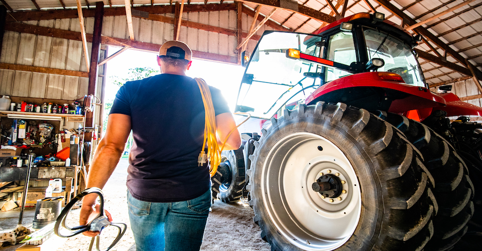 farmer alongside tractor