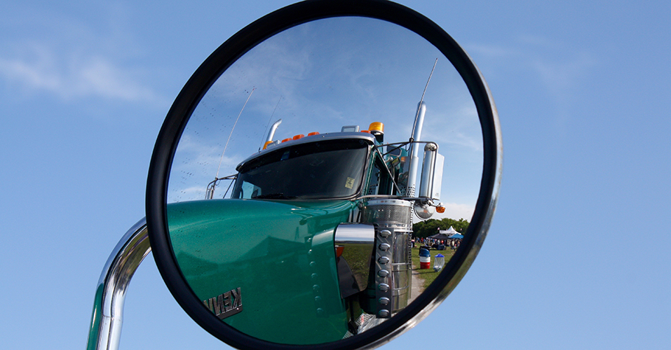 Semi truck mirror reflecting the cab