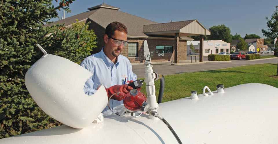 Man at a propane tank