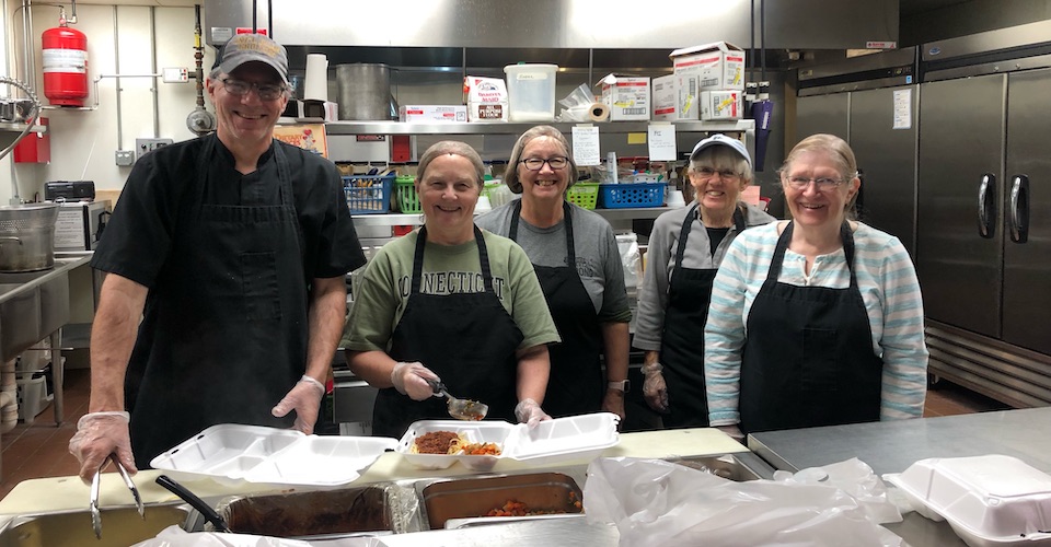 Serving food at Backus Community Cafe