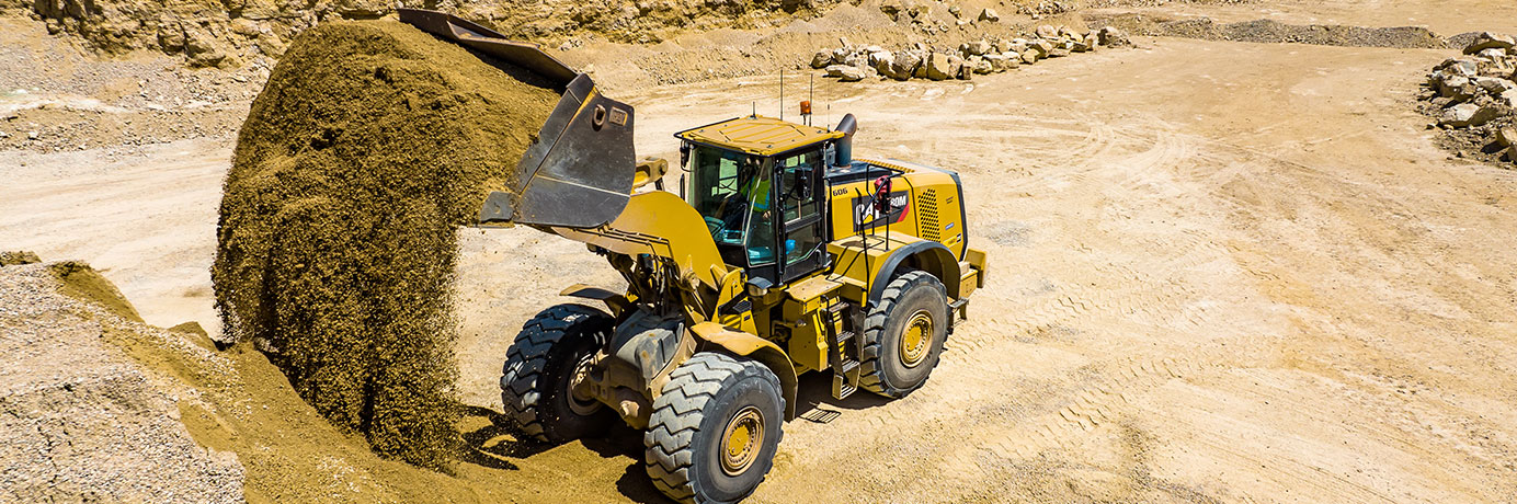 Skid steer dumping dirt