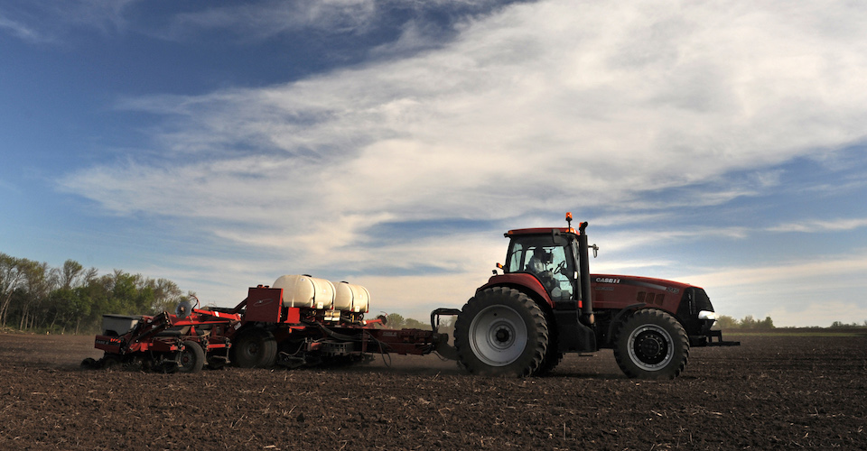 Tractor spreader on a field