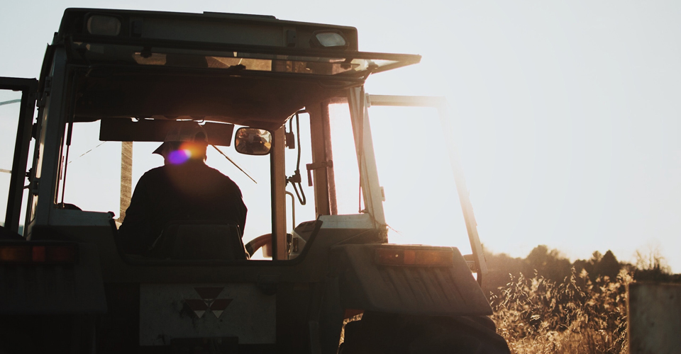 Riding a tractor into the sunset