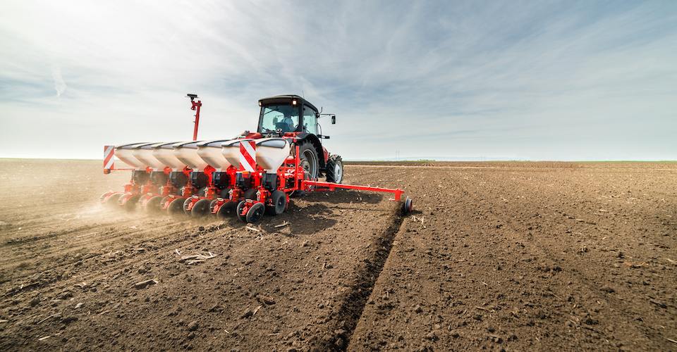 Tractor tilling a field