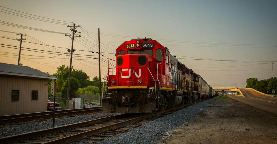 Train driving through a small town