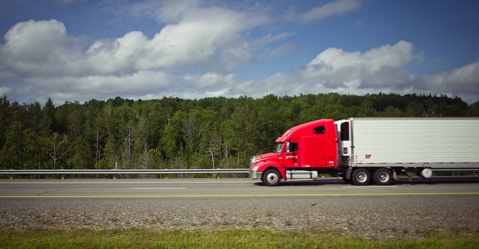 Truck driving down the road