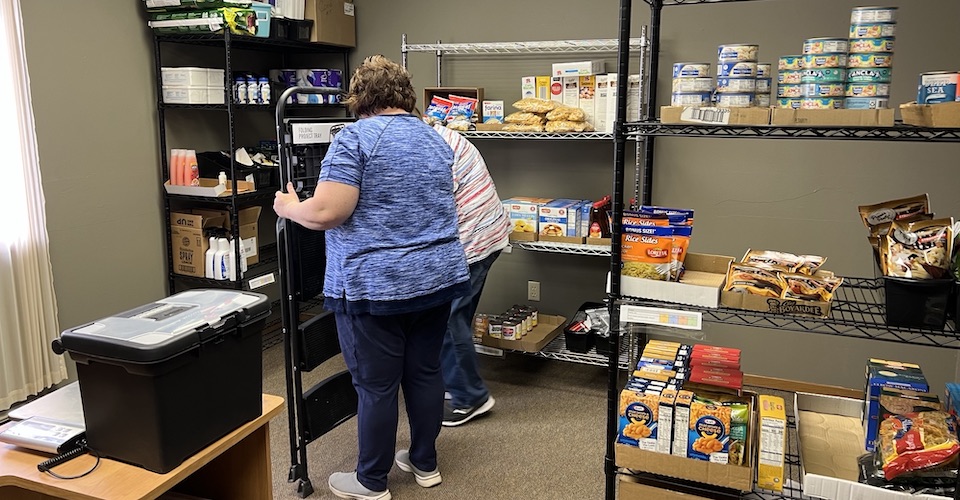Women at REACH Inc preparing food