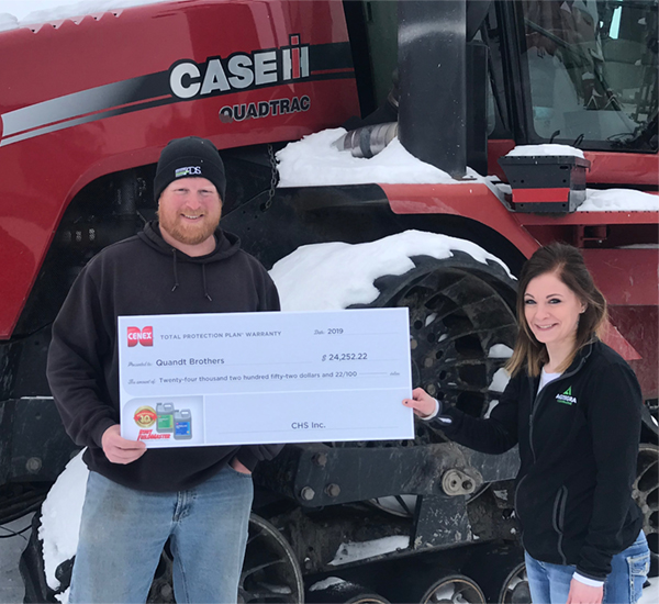 Presenting a check to the Quandt brothers