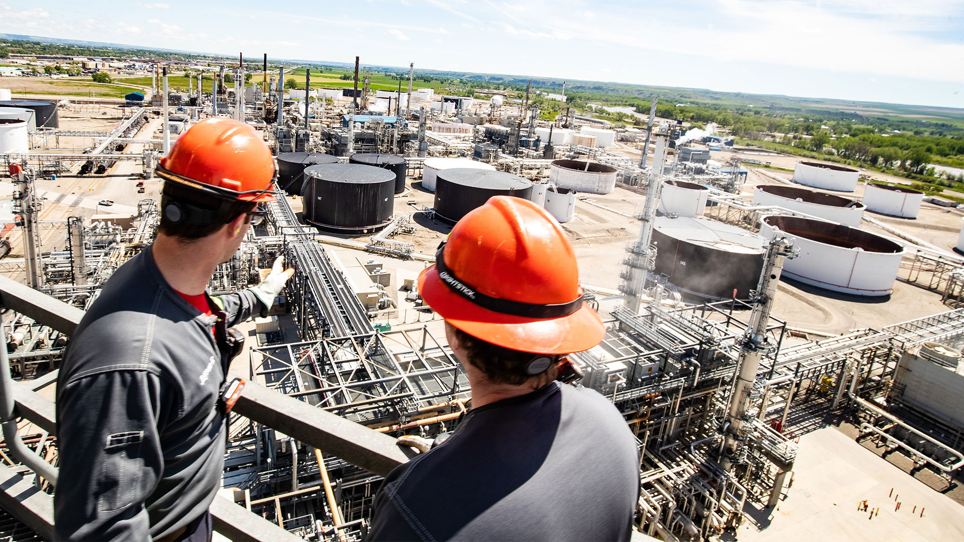 Workers overseeing refinery