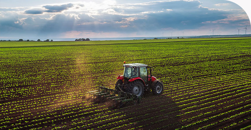 Grower spraying a field in a tractor