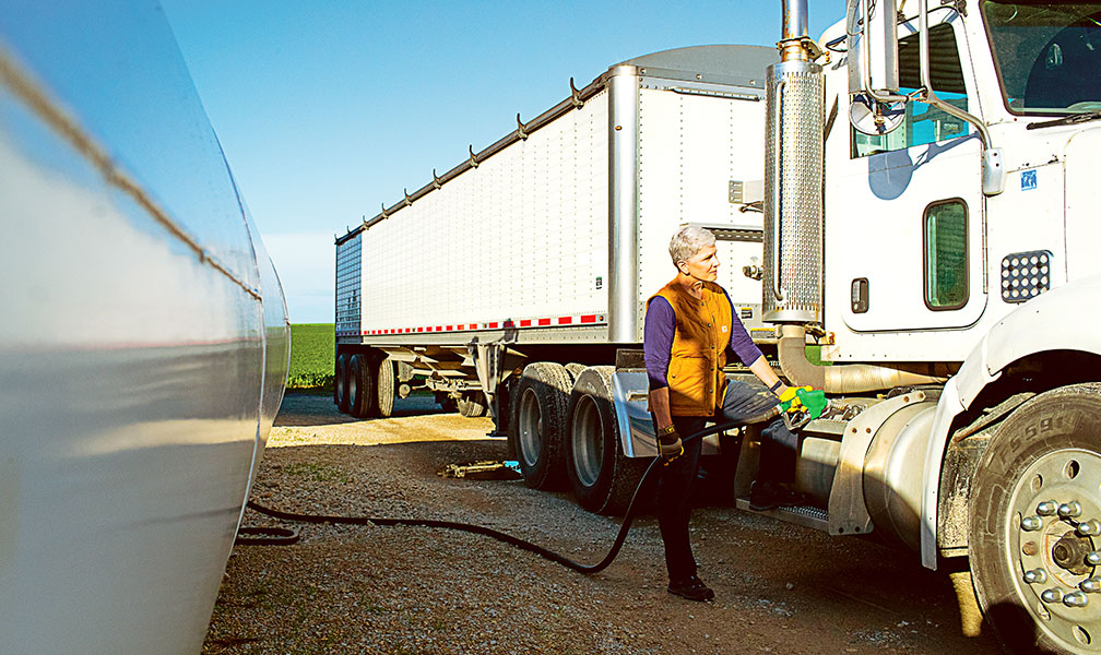 Theresa fueling a semi truck